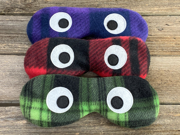 Eye masks in purple red or green plaid prints