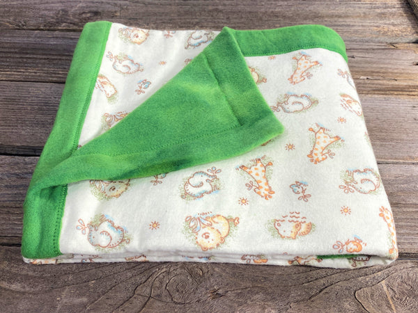 All purpose baby mat with jungle kritters and green tie dye backing