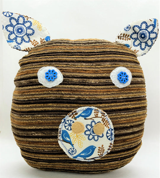 brown striped pig pillow with blue bird accent print